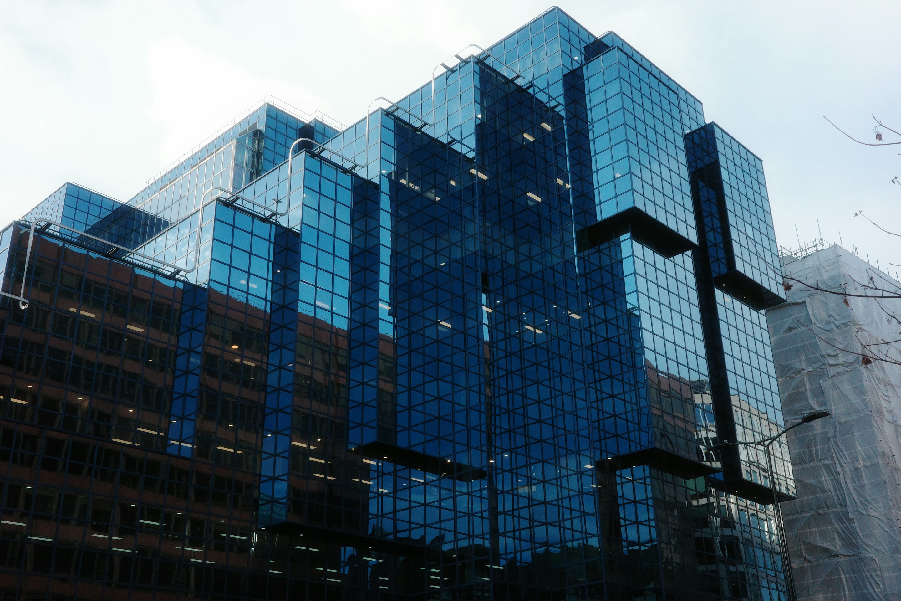 Modern commercial glass building showcasing Mega Glass projects